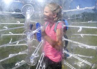 Bonnie Thiriot is pictured inside her bubble as she awaits the start of a bubble soccer practice at Craig Ranch Park on Friday, July 8, 2016. (Special to the Sun/Stephen Sylvanie)