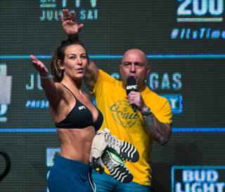 Miesha Tate salutes the fans after an interview with Joe Rogan during the UFC 200 weigh-ins at the T-Mobile Arena on Friday, July 8, 2016.