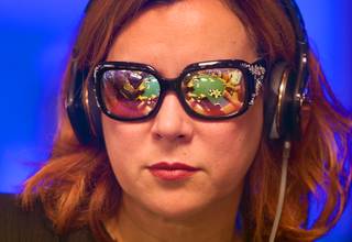 The table is reflected in the glasses of actress and poker player Jennifer Tilly as she competes in Day1C of the World Series of Poker Main Event at the Rio Monday, July 11, 2016.