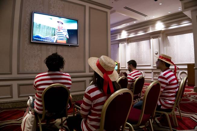 Students watch a video about the history of the gondola during a "Gondola Rowing 101" class as part of the Gondola University attraction at The Venetian Hotel & Casino, Thursday, July 7, 2016.