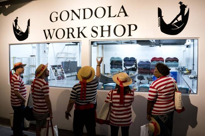 Master Gondolier Tino, center, talks about the Gondola workshop to students during a "Gondola Rowing 101" class as part of the Gondola University attraction at The Venetian Hotel & Casino, Thursday, July 7, 2016.