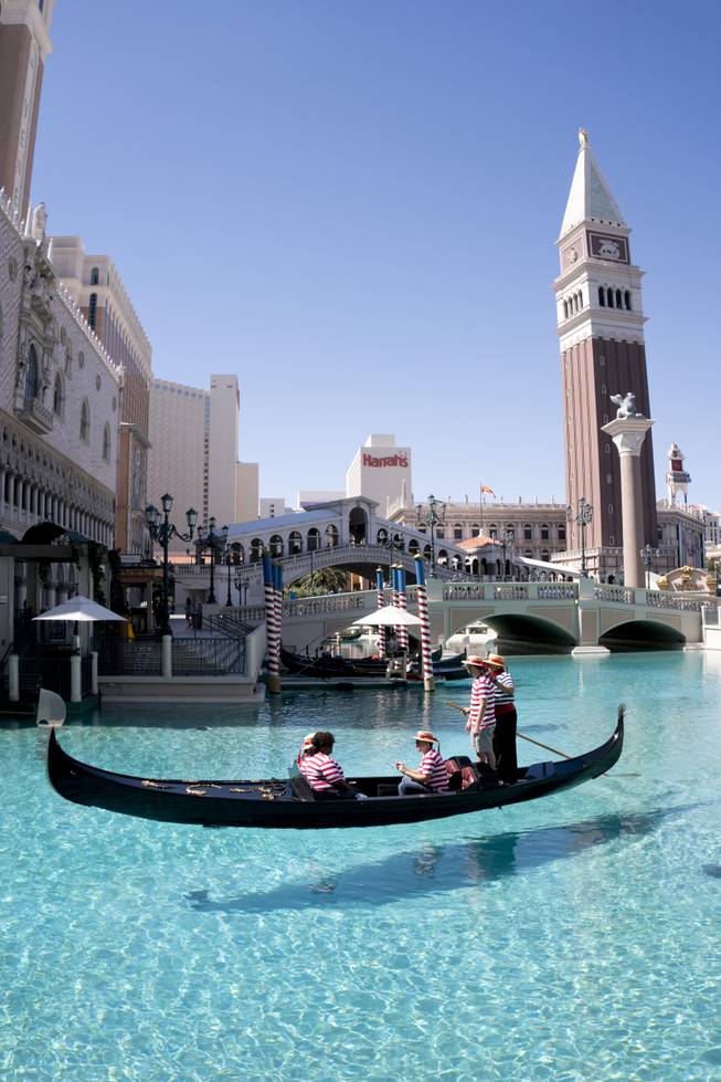 Las Vegas Weekly reporter Mark Adams receives steering instructions from Master Gondolier Tino during a "Gondola Rowing 101" class as part of the Gondola University attraction at The Venetian Hotel & Casino, Thursday, July 7, 2016.