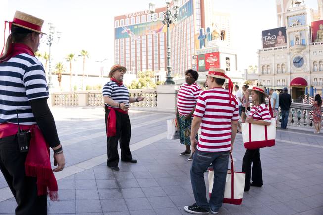 Master Gondolier Tino, center, gives students a tour of the Venetian during a "Gondola Rowing 101" class as part of the Gondola University attraction at The Venetian Hotel & Casino, Thursday, July 7, 2016.