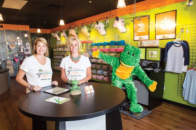 Lisa Hughes, left, and Robyn Brewington are best friends who left corporate jobs to open a Big Frog Custom T-Shirts and More franchise in Las Vegas. 