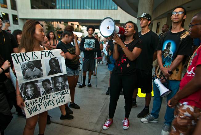 Black Lives Matter march organizer Erica White speaks to the crowd as they hold another protest and march in downtown Las Vegas on Saturday, July 16, 2016.