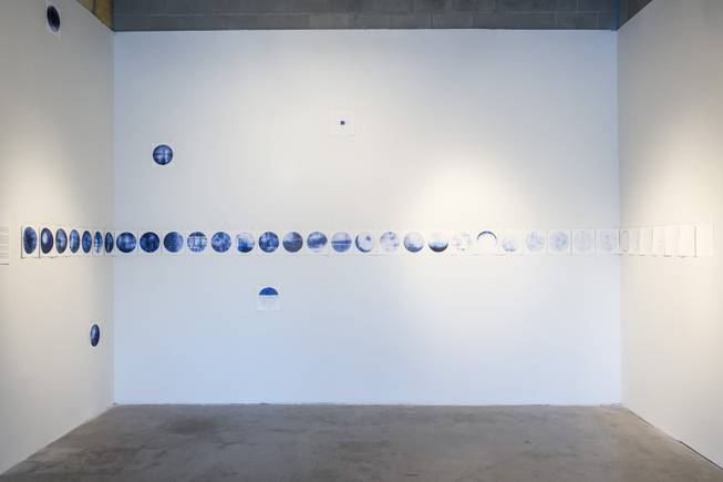 "40 Moons", an artwork by Elizabeth Stone, is seen on display as part of the "Art and Science" exhibit at the CAC, Tuesday, July 19, 2016.