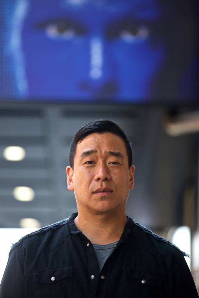 Ian Pai, who built sets and composed some of the original music used by the Blue Man Group, stands July 12, 2016, outside the troupe’s current venue in New York. Pai contends that he has been underpaid in royalties for decades and has filed a lawsuit seeking at least $150 million.