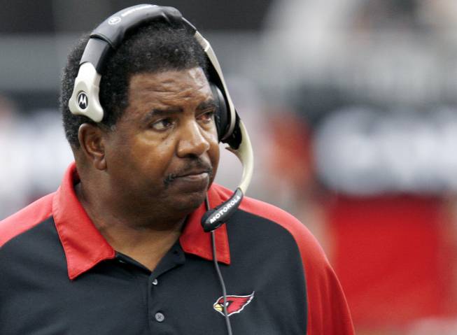 In this Sept. 24, 2006, file photo, Arizona Cardinals head coach Dennis Green watches from the sidelines during the first half of an NFL game against the St. Louis Rams in Glendale, Ariz.