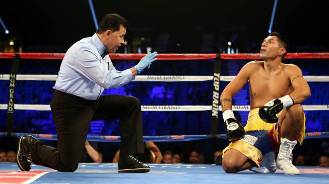 Middleweight boxer George Tahdooahnippah receives a count after being knocked down by Ryota Murata of Japan at the MGM Grand Garden Arena on Saturday, July 23, 2016.