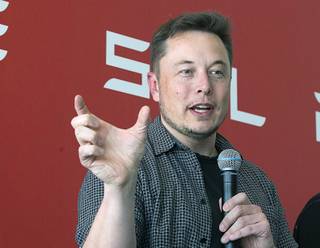 Tesla CEO Elon Musk discusses the company's new Gigafactory Tuesday, July 26, 2016, in Sparks. It's Tesla Motors biggest bet yet: a massive, $5 billion factory in the Nevada desert that could almost double the world's production of lithium-ion batteries by 2018. 