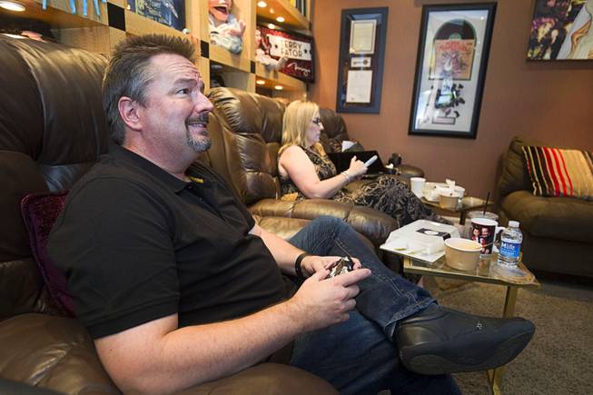 Entertainer Terry Fator plays Destiny, a first-person shooter game, in his dressing room before a performance in the Terry Fator Theatre in the Mirage Wednesday, July 27, 2016. His wife Angie is in the background. The show is expected reach a milestone of 1.5 million guests sometime this week.