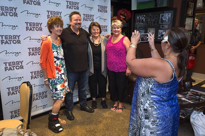 Entertainer Terry Fator, poses with guests in his dressing room before a performance in the Terry Fator Theatre in the Mirage Wednesday, July 27, 2016. From left are: Jane Lane of Denver, Marsha Cade of Philadelphia, and Debbie Leach of Canton, Ohio.