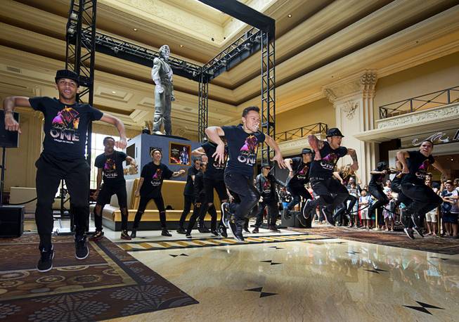Cast members of "Michael Jackson One" perform during an unveiling ceremony in the Mandalay Bay lobby Thursday, July 28, 2016. The 10-foot-tall statue is on loan from the Estate of Michael Jackson.