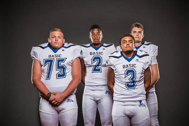Members of the Basic High football team pose for a photo at the Las Vegas Sun's high school football media day July 20, 2016 at the South Point. They include, from left, Richard Schmidt, De'Shawn Eagles, Aaron Mcallister, and Jacob Fulton.