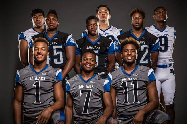 Members of the Desert Pines High football team pose for a photo at the Las Vegas Sun's high school football media day July 20, 2016 at the South Point. They include, from top left, Poutasi Poutasi, Edgar Burrola, Randal Grimes. Middle left, Jalen Graves,  Eddie Heckard, Jauta'e Collins. Bottom left, Tony Fields, Isaiah Morris, and Marckell Grayson.