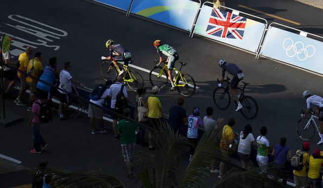 Christopher Froome, of Great Britain, left, races Daniel Martin, of Ireland, right, to the finish line in the last 250m of the men's cycling road race final along Copacabana beach at the 2016 Summer Olympics in Rio de Janeiro, Brazil, Saturday, Aug. 6, 2016. Froome finished 12th and Martin 13th.