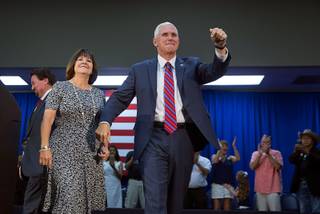 Republican vice-presidential candidate Mike Pence arrives with his wife Karen for a campaign stop at the Henderson Convention Center Wednesday, Aug. 17, 2016.
