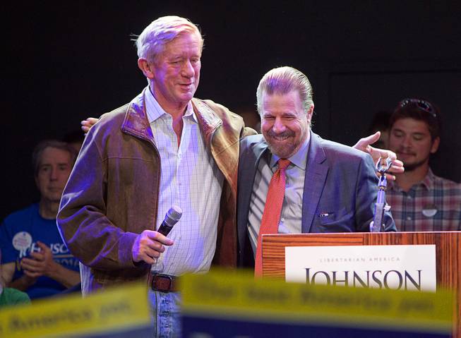 Libertarian vice-presidential candidate William Weld, former governor of Massachusetts, embraces Juan Hernandez, national chair of Hispanics for Johnson/Weld, during a campaign stop at The Foundry nightclub in the SLS Las Vegas Thursday, Aug. 18, 2016.