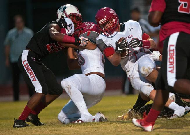Arbor View's Andrew Wagner (42) blasts through the line during their season opener with Liberty on Friday, August 26, 2016.