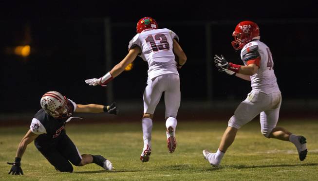 Arbor View's Michael Sims (13) evades another Liberty defender on his way to the end zone during their season opener on Friday, August 26, 2016.