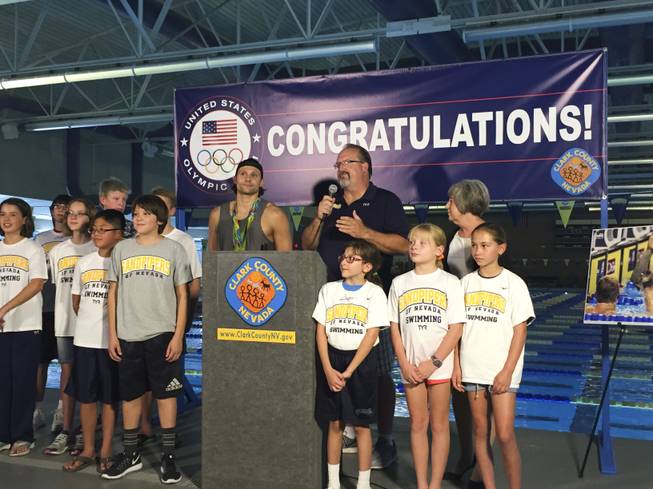 Las Vegas Olympian Cody Miller stands with Sandpipers coach Ron Aitken and current members of the Sandpipers of Nevada swim team on Monday, Aug. 29, 2016 at the Desert Breeze Aquatic Facility. Miller won gold and bronze medals during the 2016 Summer Olympics in Rio de Janeiro.