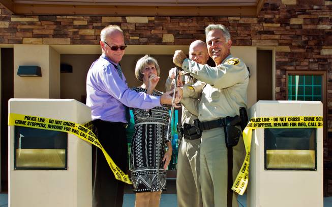 Police tape is cut during the opening ceremonies for the Spring Valley Area Command to service a portion of the western valley on Tuesday, August 30, 2016.