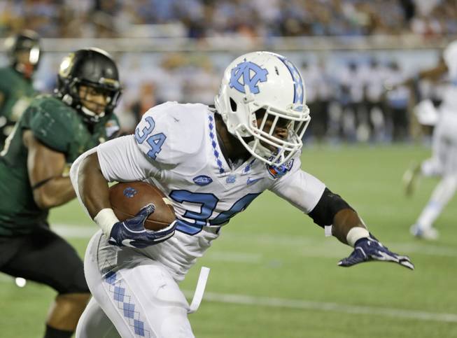 North Carolina running back Elijah Hood (34) runs against Baylor during the second  half of the Russell Athletic Bowl NCAA football game, Tuesday, Dec. 29, 2015, in Orlando, Fla. Baylor won 49-38.