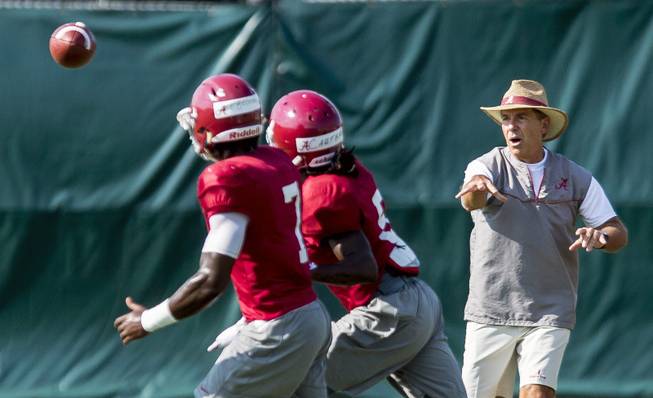 Alabama coach Nick Saban works with his players during football practice, Saturday, Aug. 27, 2016, at the Hank Crisp Indoor Facility in Tuscaloosa, Ala. 