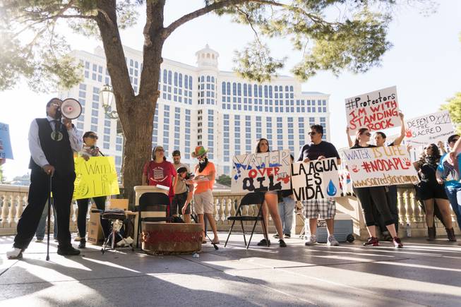William Anderson from the Moapa Valley Paiute tribe addresses the protestors on a megaphone during the "We Stand with Standing Rock" protest in support of the Standing Rock Sioux tribe, in front of the Bellagio Casino, Friday, Sept. 9, 2016. The Standing Rock Sioux tribe is fighting to stop the Dakota Access Pipeline (DAPL) from passing through their lands in North Dakota, which they say will contaminate the water and violate sacred grounds.