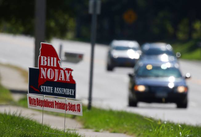 A sign supporting deceased Assemblyman Bill Nojay, who was seeking re-election, sits on Monroe Avenue near French Road on Tuesday, Sept. 13, 2016, in Pittsford, N.Y. 