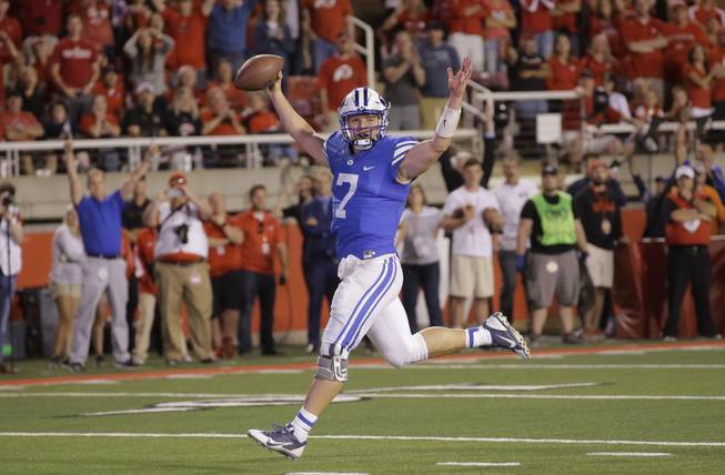 BYU quarterback Taysom Hill (7) celebrates as he scores against Utah in the second half during an NCAA college football game Saturday, Sept. 10, 2016, in Salt Lake City. Utah won 20-19. 