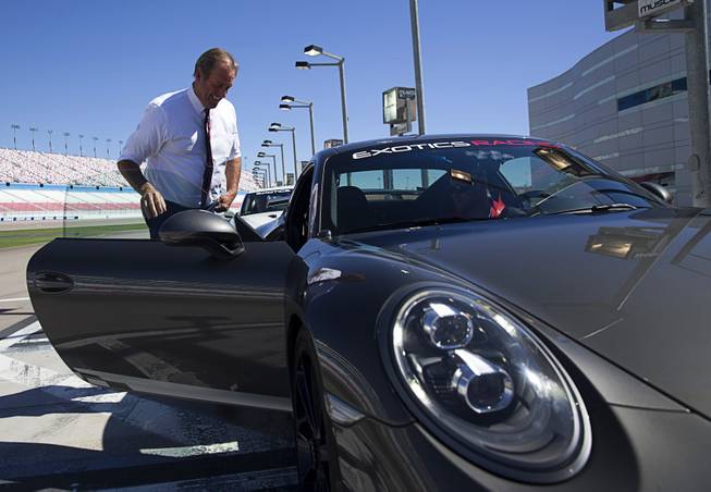 North Las Vegas Mayor John Lee enters an Exotics Racing Porsche GT3 during a Nevada Department of Transportation (NDOT) news conference at the Las Vegas Motor Speedway Monday, Sept. 19, 2016. NDOT announced the groundbreaking of a $33.8 million widening of I-15 between Craig Road and the Speedway.