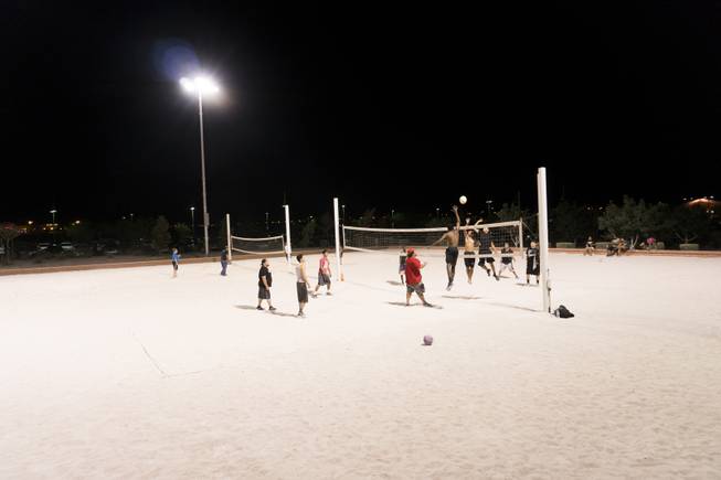 A group of people gather at the beach volleyball courts at Craig Ranch Regional Park to play some nighttime volleyball, Friday, Sept. 16, 2016.