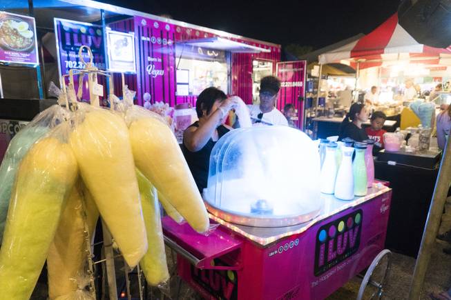 A vendor gathers cotton candy for customers during the 37th Annual San Gennaro Feast Festival at Craig Ranch Park in North Las Vegas, Friday, Sept. 16, 2016.