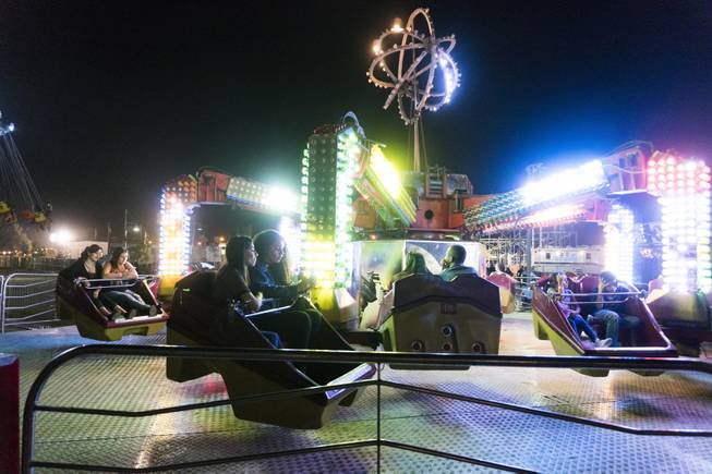 Festival goers wait for the Zipper carnival ride to start during the 37th Annual San Gennaro Feast Festival at Craig Ranch Park in North Las Vegas, Friday, Sept. 16, 2016.