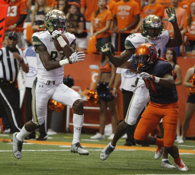 South Florida's Rodney Adams runs into the end zone for a touchdown in the second quarter of an NCAA college football game against Syracuse in Syracuse, N.Y., Saturday, Sept. 17, 2016. 