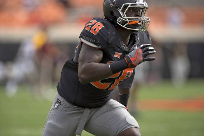 Oklahoma State wide receiver James Washington practices prior to the start of an NCAA college football game between Central Michigan and Oklahoma St in Stillwater, Okla., Saturday, Sept. 10, 2016.
