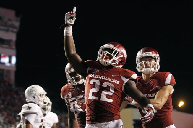 Arkansas' Rawleigh Williams III (22) celebrates after scoring a touchdown in the third quarter of an NCAA college football game against Texas State Saturday, Sept. 17, 2016 in Fayetteville, Ark. Arkansas beat Texas State, 42-3.