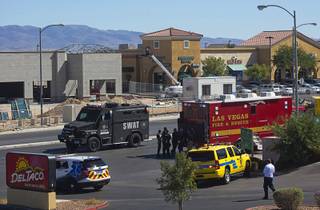 A SWAT vehicle leaves the scene after a shooting at the Starbucks on South Rainbow Boulevard near Warm Springs Road Sunday, Sept. 25, 2016. One man was killed after the shooting in the Starbucks, police said.