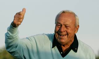 Former Masters champion Arnold Palmer acknowledges the crowd April 5, 2007, after hitting the ceremonial first tee shot prior to the first round of the 2007 Masters golf tournament at the Augusta National Golf Club in Augusta, Ga. Palmer, who made golf popular for the masses with his hard-charging style, incomparable charisma and a personal touch that made him known throughout the golf world as 