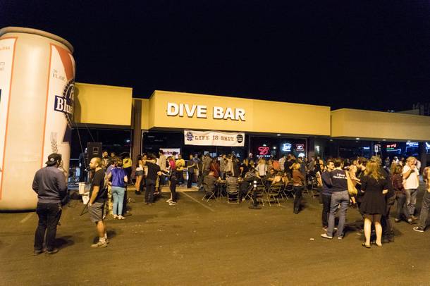 The crowd hangs out outside in-between acts during the Life is Sh*t festival at the Dive Bar, Friday, Sept. 22, 2016.