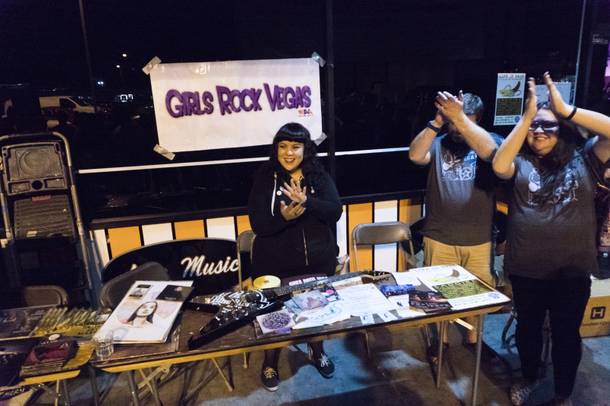 Members of the Girls Rock Vegas cheer for the winners of a raffle for items from their table during the Life is Sh*t festival at the Dive Bar, Friday, Sept. 22, 2016. Girls Rock Vegas, an organization who seeks to empower girls from ages 8-17 through music programs, was the recipient of the night's raffle donations.