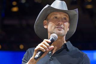 Country music star Tim McGraw says a few words after unveiling a Tim  McGraw-themed slot machine in the Aristocrat booth during the Global Gaming Expo (G2E) convention at the Sands Expo and Convention Center Tuesday, Sept. 27, 2016.