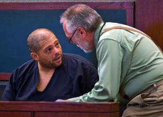 Pedro Jose Garcia, 34, speaks with his Deputy Public Defender Edward Kane as he makes his first court appearance being accused in Sunday's shooting at a southwest valley Starbucks that left a man dead on Wednesday, Sept. 28, 2016.