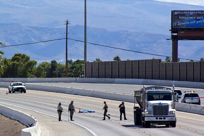 Metro Police investigate a fatal accident on U.S. 95 northbound near the Boulder Highway exit Thursday, Sept. 29, 2016. Police say a man sought for questioning was struck and killed by a tractor-trailer when he tried to run from police across the highway. 