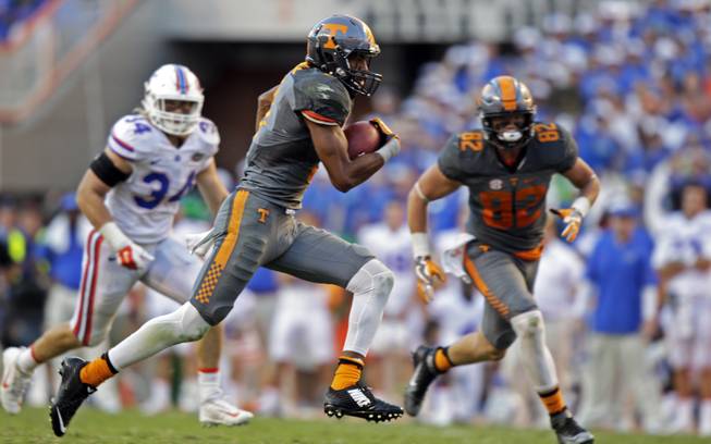 Tennessee wide receiver Josh Malone (3) runs for a touchdown during the second half of an NCAA college football game against Florida Saturday, Sept. 24, 2016, in Knoxville, Tenn. Tennessee won 38-28. 