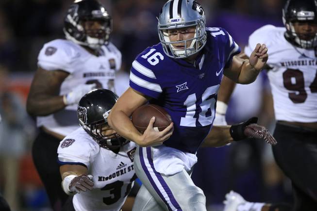 Kansas State quarterback Jesse Ertz (16) gets tackled by Missouri State linebacker Dylan Cole (31) after a 35-yard run during the first half of an NCAA college football game in Manhattan, Kan., Saturday, Sept. 24, 2016. 