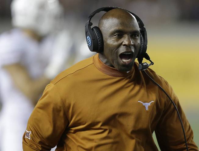 Texas coach Charlie Strong yells during the first quarter of an NCAA college football game against California Saturday, Sept. 17, 2016, in Berkeley, Calif. 