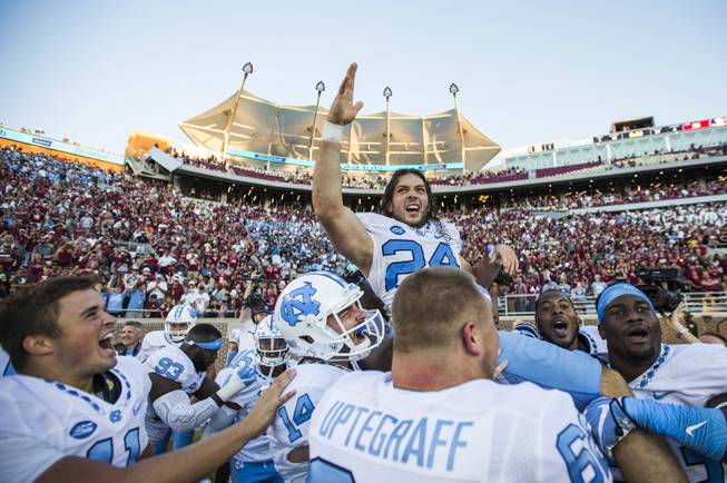 Players from North Carolina hoist kicker Nick Weiler on their shoulders after Weiler kicked the game winning 54-yard field goal against Florida State in an NCAA college football game in Tallahassee, Fla., Saturday, Oct. 1, 2016. North Carolina defeated Florida State 37-35. 