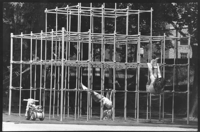 Children climb on a jungle gym in New York in 1986.